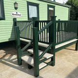 An example of a fully installed 18' x 8' side patio with steps in the cream and dark green colours