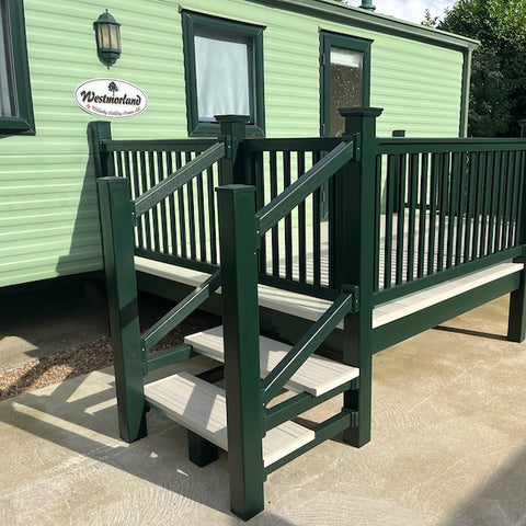 An example of a fully installed 18' x 8' side patio with steps in the cream and dark green colours