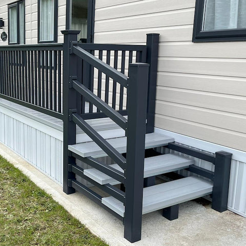 An example of a fully installed 6' x 3' 3" entry platform with steps in the light grey and anthracite colours